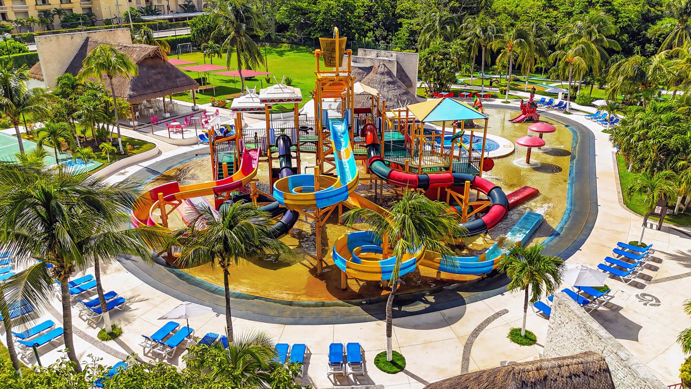 Colourful twisting water slides and splash pools at All Ritmo Cancún Water Park